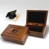 Graduation keepsake box made of wood, featuring a cap and diploma design for storing mementos.