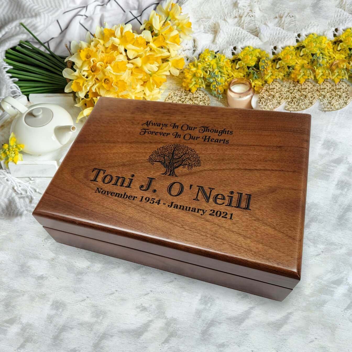 Memorial Canvas: Grieving wooden box adorned with heartfelt messages and symbols of remembrance.