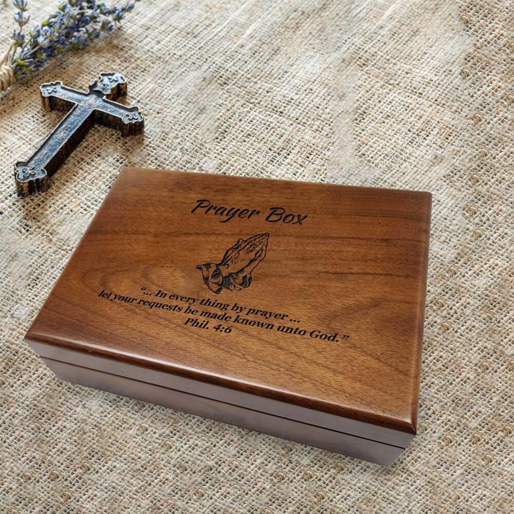 A wooden prayer box with an engraved image of praying hands and the quote "... In every thing by prayer... let your requests be made known unto God." Phil. 4:6